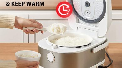 Compact Toshiba mini rice cooker on a dorm desk with steaming rice