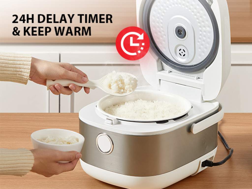 Compact Toshiba mini rice cooker on a dorm desk with steaming rice