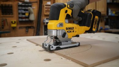 DEWALT 20V MAX DCS331B cordless jigsaw cutting curved wood piece in workshop