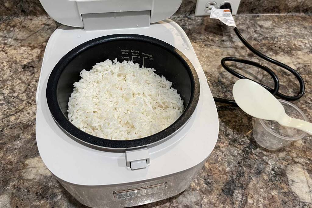Toshiba 3-cup rice cooker in a small apartment kitchen cooking brown rice