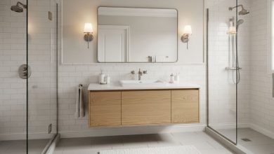 Transitional style bathroom featuring white subway tiles, floating wood vanity, and brushed nickel fixtures with neutral color palette