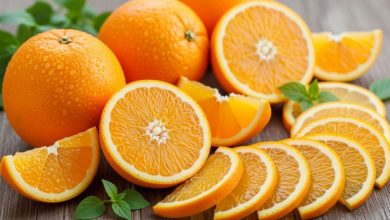 Fresh whole oranges and orange slices showing vitamin C-rich flesh that provides antioxidant protection against oxidative stress