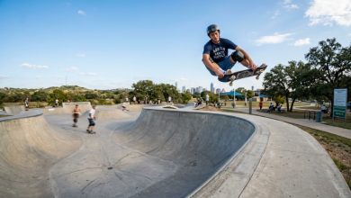 Skater performing a trick on an outdoor ramp at a public Texas skate park.