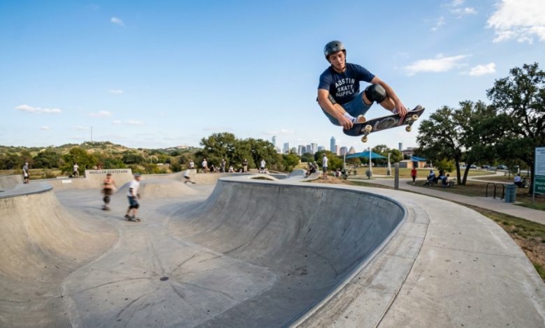Skater performing a trick on an outdoor ramp at a public Texas skate park.