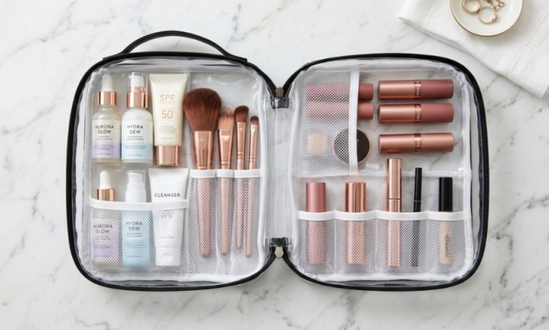 Organized cosmetics inside clear travel makeup bag on marble counter