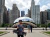Beginner holding a colorful skateboard in an Illinois park.